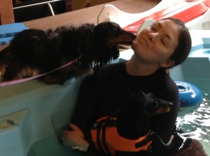 A woman holding a dog